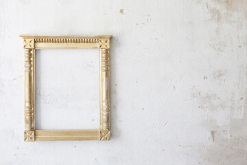 golden wooden frame on old wall
