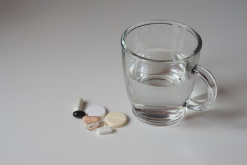 pills and glass with water