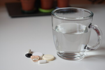 glass of water and pills
