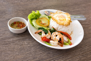 hot fried shrimp and egg with basil and rice.