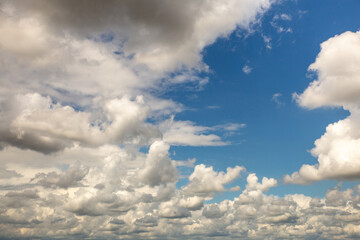 Blue sky and white and gray clouds