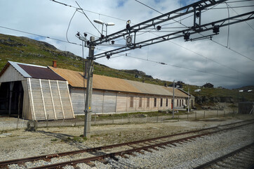 Obraz premium Views from the train window. Mountain tundra of Central Norway. Railway travel in Norway.The Bergen - Oslo train.