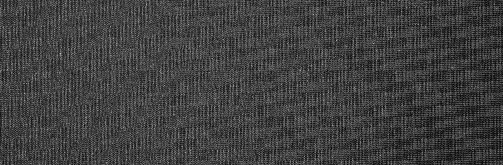 Fototapeta na wymiar Texture of dense black fabric.Dark grey braided background.