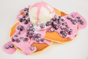 Ice cream with pancakes and blackcurrant berries