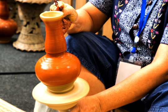 Thai handcraft potery made training in movement action.
