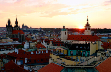Obraz premium Most Prague through the eyes of birds with magnificent sunset and sky over the traditional houses with red roofs.