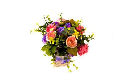 handcraft flowers in white ceramic vase with white background.