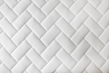 Close up shot of white orthopedic mattress top side surface pattern with a lot of copy space for text. Hypoallergenic foam matress for proper spinal alingment and pressure point relief. Background.