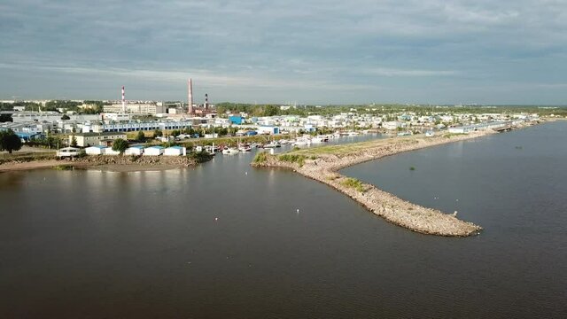 4K summer late afternoon aerial video of Baltic Sea Finnish Bay lagoon, Saint Petersburg boat parking yacht club area, boats and calm water surface in the northern capital of Russia