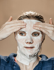 a girl in a trance mask for wrinkles and for smoothness and youthfulness of skin nutrition....