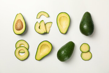 Flat lay with avocado on white background, top view