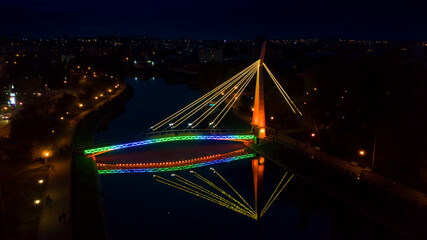 Glowing bridge on the waterfront.