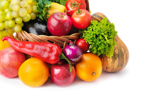Vegetables and fruits in a basket isolated on white background. Free space for text.