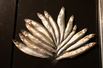 Silver fresh fish show for sale in market.