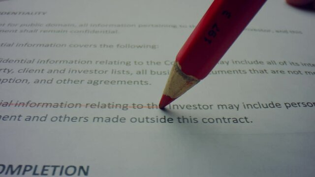 Pencil drawing line on paper. Person editing printed document with wooden pencil