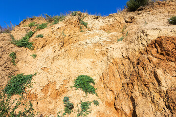 The collapse of wet sandy soil on the coast
