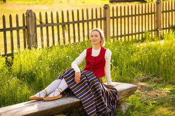 Latvian woman in traditional clothing. Ligo folk.