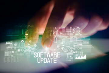 Finger touching tablet with web technology icons and SOFTWARE UPDATE inscription