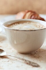 Coffee with milk on bright stone background. Close up.