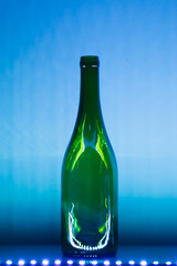 abstract empty wine bottle with blue led illumination