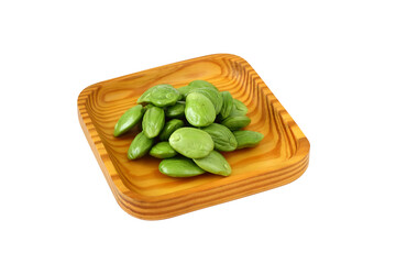 Bitter bean, Twisted cluster bean or Stink bean in wood plate on white background. thai name is sator 