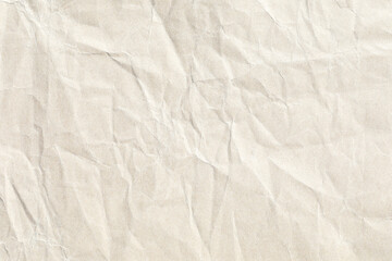 Pale crumpled yellow paper texture