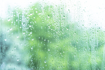 Raindrops on wet window pane