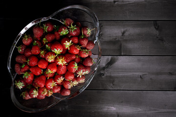 Ripe strawberries on a wooden background