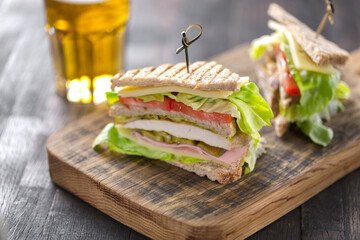 club sandwich served with beer