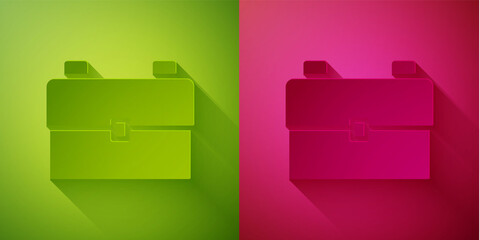 Paper cut School backpack icon isolated on green and pink background. Paper art style. Vector Illustration.