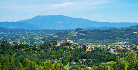 Fototapeta na wymiar Great view of the medievel village, vineyards and countryside landscape in Gordes, Vaucluse, Provence, France, Europe. Famous Cotes du Rhone Tourist Route. Picturesque scene. Beauty world.