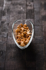roasted and salted cashews in a glass dish