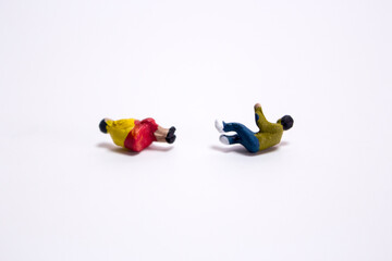 The old married couple falling down at the same time on the isolated white background.