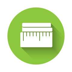 White Tape measure icon isolated with long shadow. Measuring tape. Green circle button. Vector Illustration.