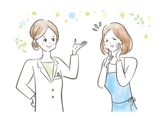 白衣を着た女性医師に悩みを相談する若い女性/主婦