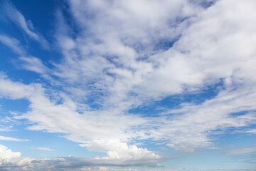View of Puffy White Clouds with Blue Sky during a beautiful Sunny Day. Taken over Vancouver,...