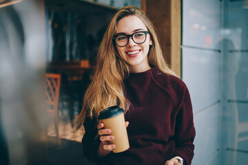 Portrait of cheerful caucasian female teenager in stylish spectacles for provide eyes protection © BullRun