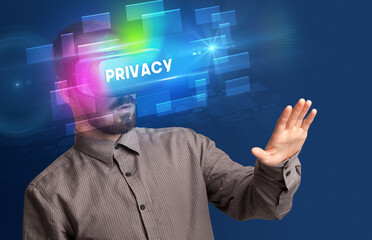 Businessman looking through Virtual Reality glasses with PRIVACY inscription, innovative security concept