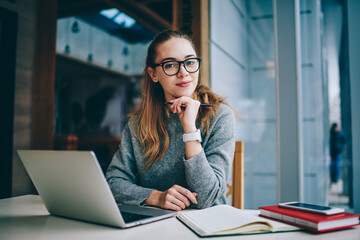 Portrait of cheerful hipster girl wear in spectacles for provide eyes protection