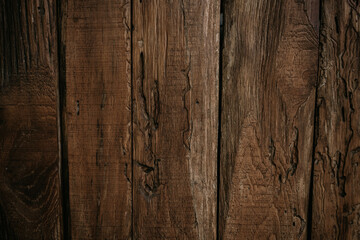 Old dark brown wooden background with vignette