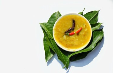 Homemade Mango Chutney or Sauce in a Plate on Mango Leaves Isolated on White Background in Horizontal Orientation with Copy Space