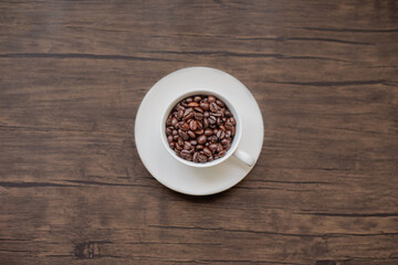 roasted coffee beans, blure background and mug