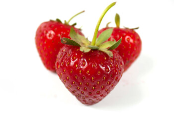 three red strawberry isolated on white background
