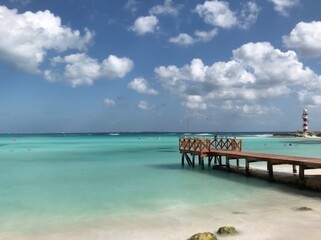 tropical beach with wooden pier