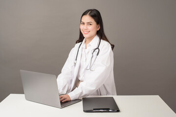 Doctor woman is analysis data on laptop computer