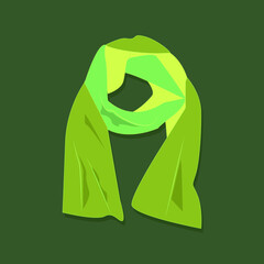 Warm autumn scarf on a green background