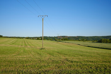 A high-voltage line runs through the rural area of ​​the northern Eifel