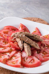 Seasoned tomato with melva ready to eat. Spanish restaurant dish