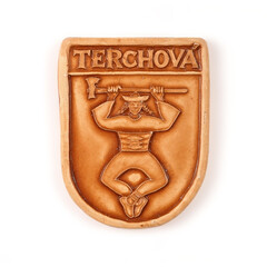 Magnetic souvenir from Slovakia with the image of the forest-folk hero bandit  isolated on white background. The inscription on the magnet Slovak village name means 