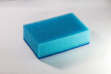 Sponge. Blue sponge. Side view. Sponge on a white background.